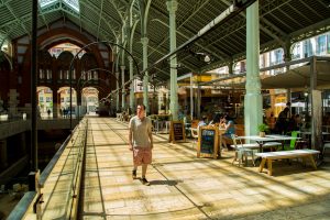 guest walking through Colon Market