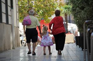 child walking with grandparents in Valencia